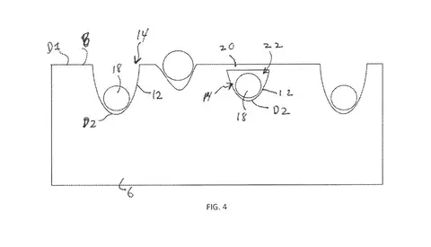 Diagram from patent shows circles being embedded in a rectangular material. 