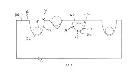 Diagram from patent shows circles being embedded in a rectangular material. 