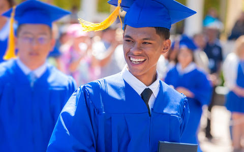 The Charter School of San Diego photo showing a male student graduating.