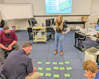 Photo of Mass Metrology Seminar student metrologists engaged in class activities.