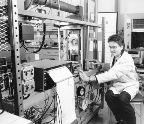 Vytenis Babrauskas, working in front of the cone calorimeter device that he invented