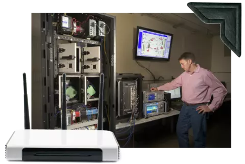 In main photo, a man stands near a counter holding electronic equipment. Photo of router is overlaid in lower left.