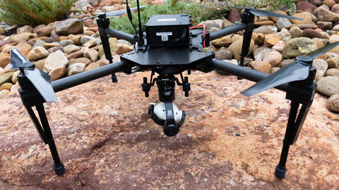 A drone on display on a rock surface.