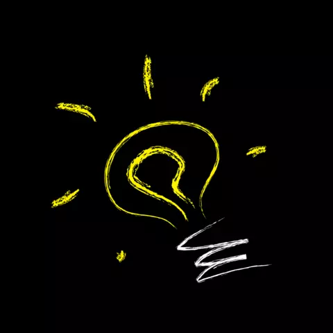 Yellow lightbulb on black background