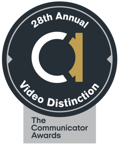 Black circle. White and gold lowercase A in the middle. Words around edge read: 28th Annual Video Distinction. Silver box below saying The Communicator Awards