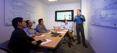 Dr. Carl Miller, a mathematician in the NIST Computer Security Division and a Fellow of the Joint Center for Quantum Information and Computer Science, discusses quantum algorithms with QuICS students and postdocs. 