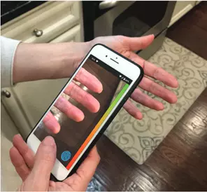 Image of smart phone demonstration mobile fingerprint scanning technology from the Telos team