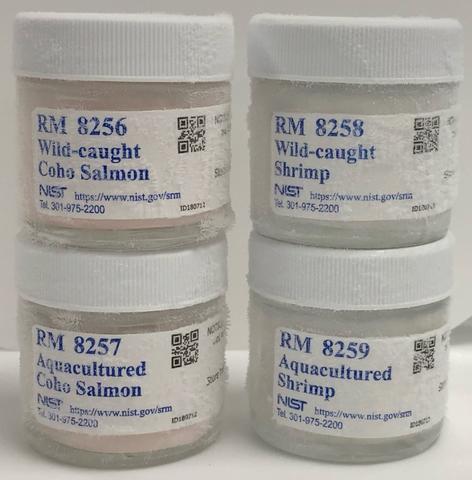 Picture of jars containing reference materials 8256, 8257, 8258, and 8259: Wild caught and aquacultured shrimp and salmon