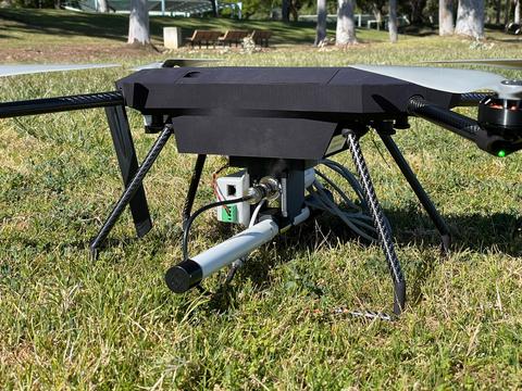Photo of drone sitting on grass