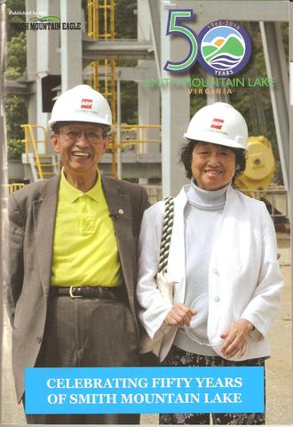 Magazine cover shows a smiling man and woman in construction hats and says "Celebrating Fifty Years of Smith Mountain Lake."