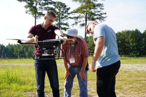 Image of three team members from ManTech/Flyt at the NIST PSCR 2021 First Responder UAS 3.2: LifeLink Stage 3 Live Demonstration