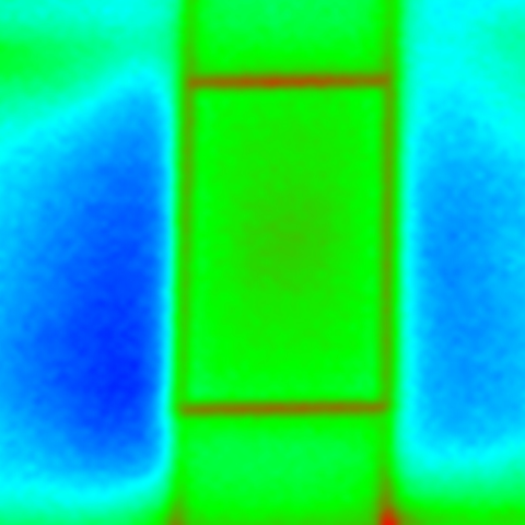 Infrared image shows cross-section of wall in green with more blue on left and less blue on right. 
