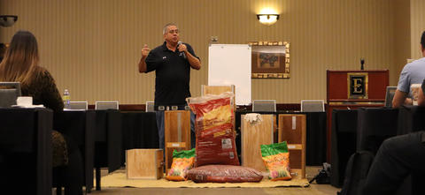 David speaking in front of a mulch and soil testing demonstration