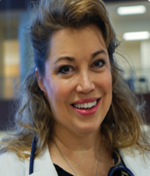 Head shot of a woman in a doctor's coat