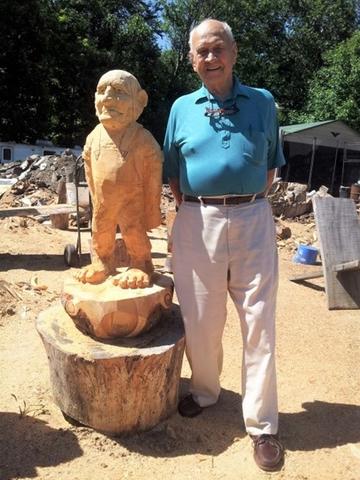 Otto Warnlof with a statue