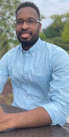 Akeem Henry poses for a picture outdoors.