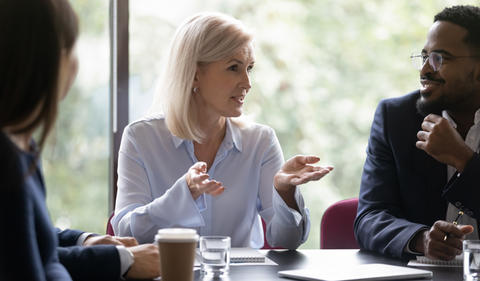 Woman leader meeting with staff.