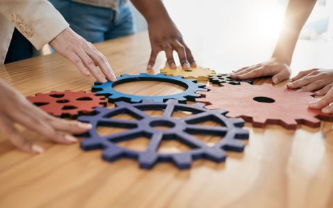 Hands on gears on a table