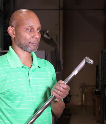 NIST's Aaron Johnson holding the new NIST pitot tube