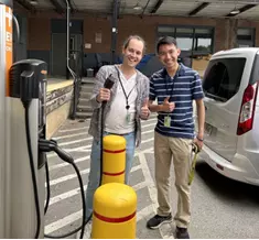 Bryan Rezende (l) and Ben Tran (r) examining one of the AC Level 2 EV charging stations on the NIST Gaithersburg campus