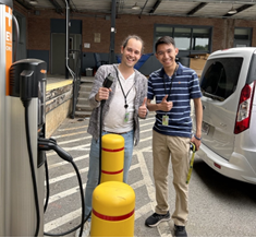 Bryan Rezende (l) and Ben Tran (r) examining one of the AC Level 2 EV charging stations on the NIST Gaithersburg campus