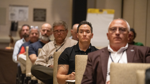 Attendees listen during a 5x5 session.