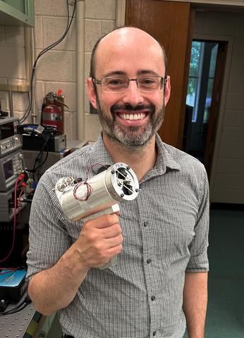 NIST researcher Jared Strait with a prototype hand-held KDFR