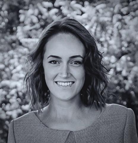 A photo of a woman in business attire
