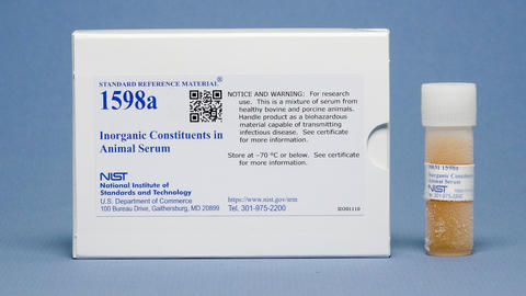 Photograph of SRM 1598a Inorganic Constituents in Animal Serum showing a labeled box and frozen sample vial. 