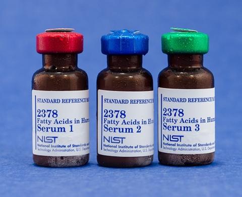 Photograph of SRM 2378 Fatty Acids in Human Serum showing three vials labeled Serum 1, Serum 2, and Serum 3.