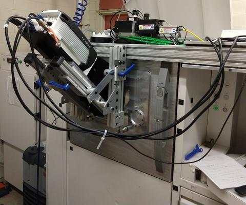 200 watt industrial laser-based powder bed fusion (LB-PBF) system with custom door and in-situ thermographic camera.