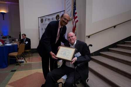 Jeffrey M. Voas receives the Distinguished Career Award in Computer Science from Ram Sriram