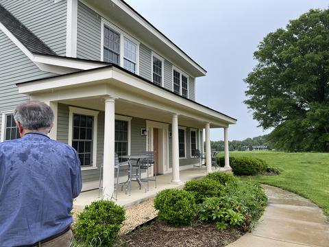 Man standing in front of a house