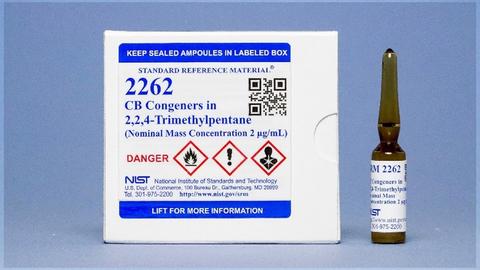 Photograph of a unit of SRM 2262 consisting of a labeled box and a labeled amber vial.