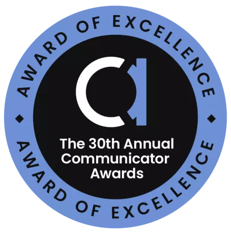 Circle badge. Blue outer ring with black lettering reading Award of Excellence at the top and bottom. Inside is black with a lowercase A and then the words The 30th Annual Communicator Awards