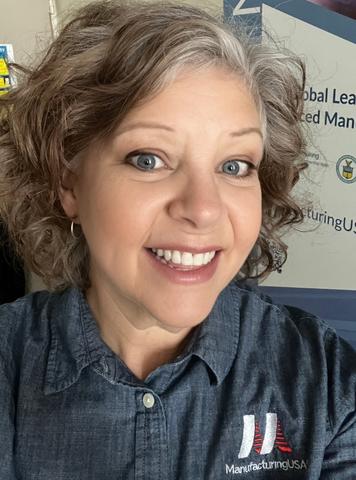 Photo of Dr. Kelley Rogers wearing a Manufacturing USA logo shirt
