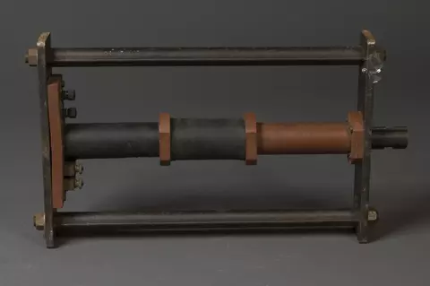 Reference specimen holder used to magnetically compare prison bars, circa 1930s. The holder is metal.