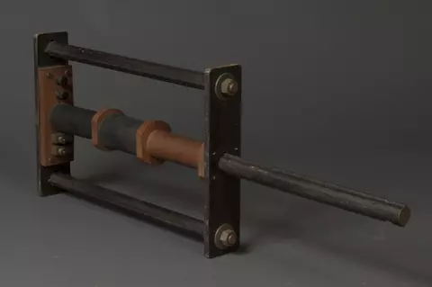 Reference specimen holder with extension pole out used to magnetically compare prison bars, circa 1930s.