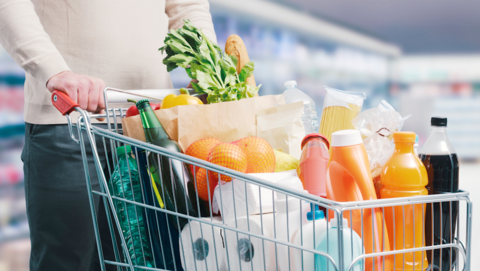 Man pushing a shopping cart at the supermarket