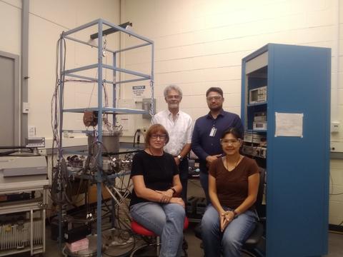 Four people in a laboratory