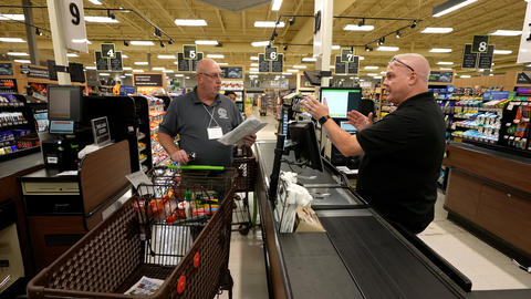 OWM’s John McGuire discussing price verification to participant of seminar