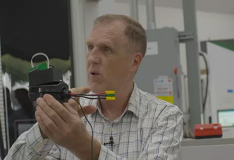 Photo of Ted Bohn with EVSE equipment