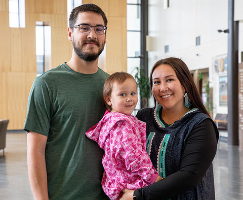 2024 Baldrige Best Practice Spotlight Southcentral Foundation showing a small child and her parents at the in the lobby of hospital.