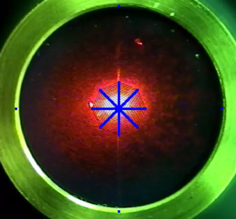 microphone diaphragm with laser spot and overlaid laser scan pattern