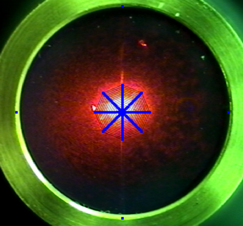 microphone diaphragm with laser spot and overlaid laser scan pattern