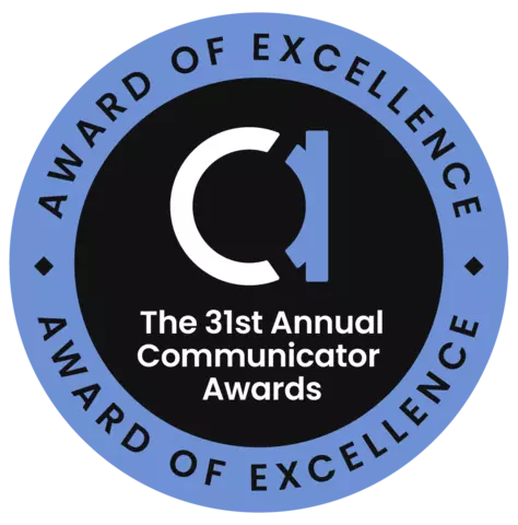 Circle badge. Center has a fancy lowercase "A" and reads: The 31st Annual Communicator Awards. The outer ring reads: Award of Excellence