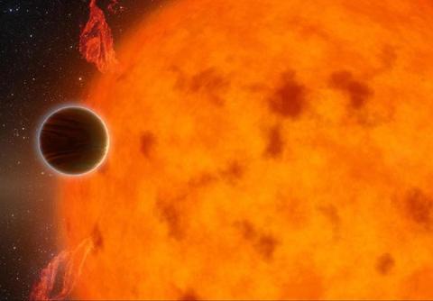 Close-up of sun with planet passing before it
