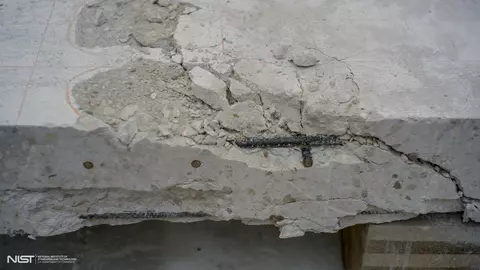 Photo of cracked white concrete slab