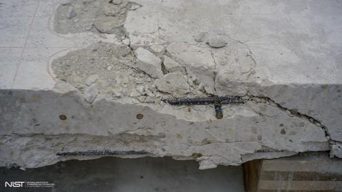 Photo of cracked white concrete slab