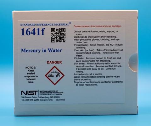 White paper box package containing label that reads Standard Reference Material 1641f Mercury In Water. It also contains a danger sign, NIST logo and additional small print that is not legible.